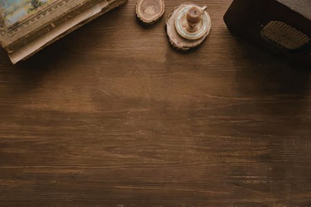 A dark wooden table with two shells and other decorative items on top