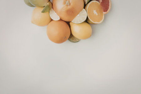 A vibrant arrangement of fresh citrus fruits including oranges, lemons, and limes.