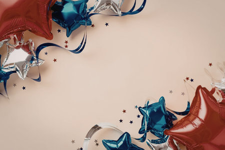 Red blue and silver star shaped balloons with ribbons and confetti on a beige background creating a festive atmosphere.の写真素材