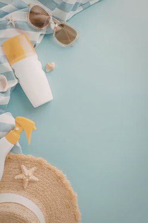 Essential summer vacation sun protection items including lotion spray sunglasses a straw hat and...