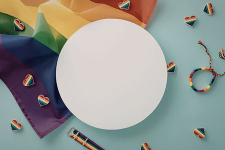Rainbow colored pride flag with accessories like hearts and a bracelet surrounding a blank white circle for text and customization.の写真素材