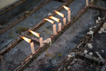 A detailed close-up of railway tracks featuring a switch in a dark environment