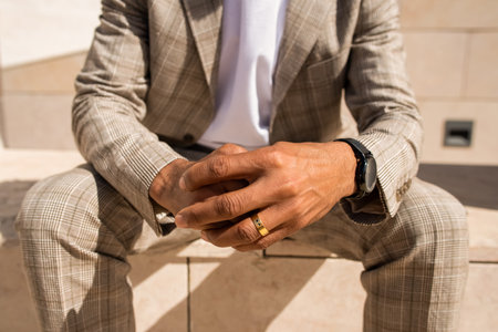 Close-up of African American man hands. Male hands with ring and watch. Human body conceptの写真素材