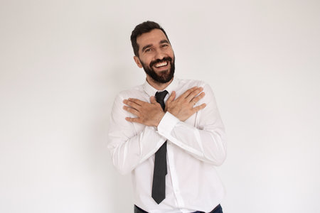 Portrait of funny man with beard. Male in suit gesturing, looking at camera. Portrait, emotion conceptの写真素材