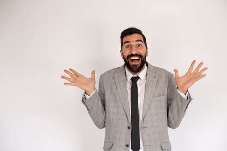 Portrait of happy bearded man. Male in suit gesturing happily. Portrait, emotion conceptの写真素材