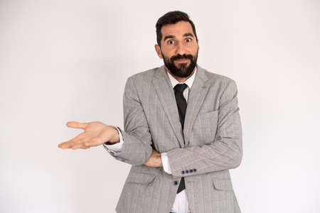 Portrait of amazed bearded man. Male in suit gesturing with surprise. Portrait, emotion conceptの写真素材