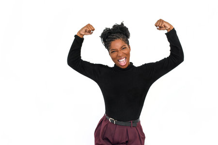 Portrait of expressive African American woman. Female model in turtleneck with curly hair looking at...