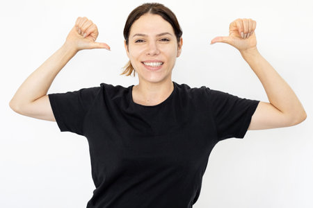 Happy Caucasian woman looking at camera and pointing at herself. Cheerful woman smiling and pointing...