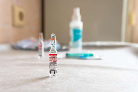Lipetsk, Russian Federation - April 29, 2021: Ampoule with Russian vaccine from covid the Sputnik V...