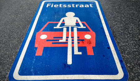 Fietsstraat traffic sign on tarmac indicating bicycle roadのeditorial素材