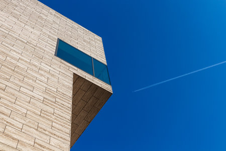 modern urban office building against blue skyの写真素材