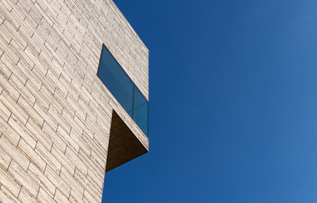 LEUVEN, BELGIUM - JUNE 21, 2019: modern urban office building against blue skyのeditorial素材