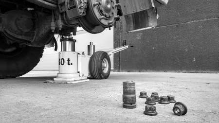 heavy duty off road truck propped up without rear wheelの写真素材