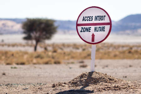 Sahara Desert, Morocco - January 2, 2017: No trespassing to military zone road warning sign in the desertのeditorial素材