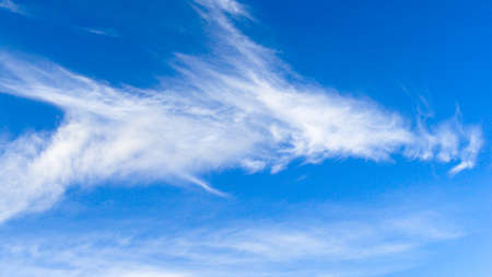 Blue sky with white feather cloud, Swedenの写真素材