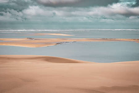 Sea with oyster bay seen from a huge sand dune, Dune du Pilat, Franceの写真素材