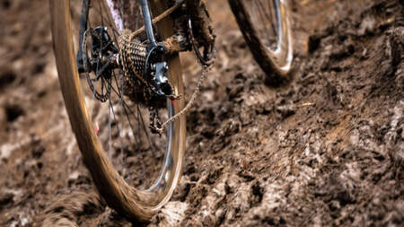Cyclocross bicycle rear wheel sliding through muddy trackの写真素材