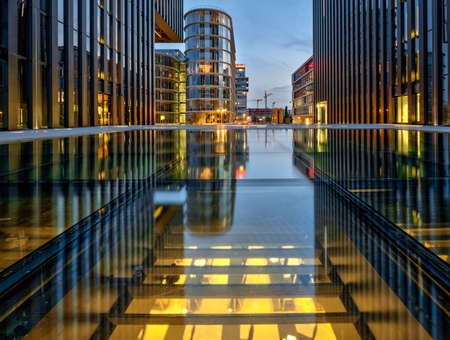 DÃ¼sseldorf, Germany - July 13, 2017: Night shot of the illuminated Hyatt hotel in the Medienhafen...