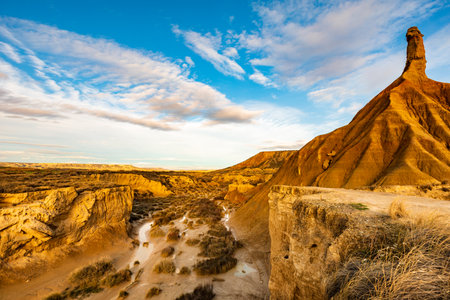 Sunset illuminating famous rock formation in national park desert, Bardenas Reales, Spainの写真素材