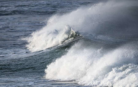 seascape close-up of a breaking wave with surf and spray, Atlantic ocean