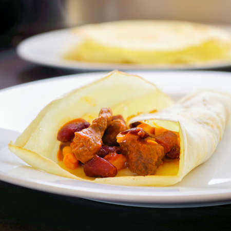 surface level close-up of mexican food chili con carne on white dishの写真素材