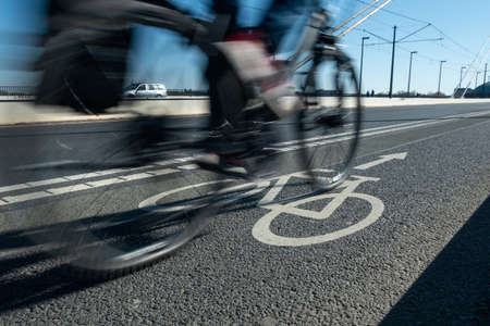 City bicycle Lane in heavy traffic with motion blur