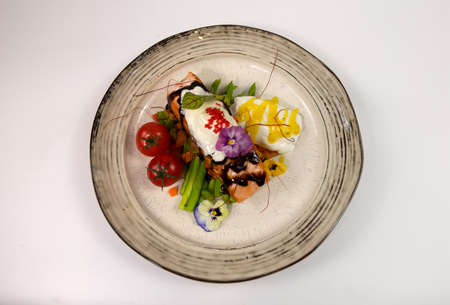 grilled salmon steak with vegetablesの写真素材