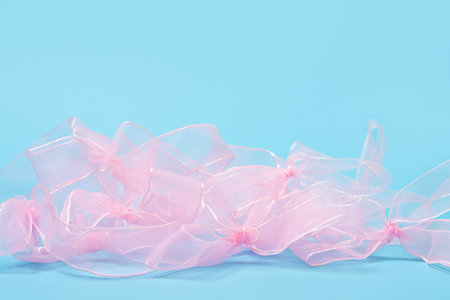 Pink bows on a blue backgroundの写真素材