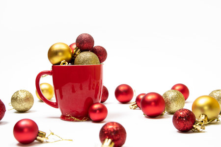 Christmas background with red and gold ornaments in a red cupの写真素材