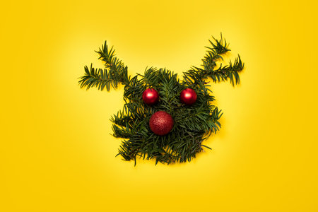 Reindeer made from Christmas tree branches with red ornaments. Christmas concept.の写真素材