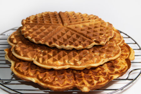 Waffles cooling on a metal rackの写真素材