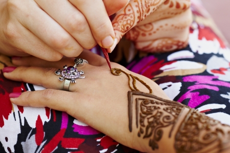 The Indian pattern is drawn a girl. Mehandiの写真素材