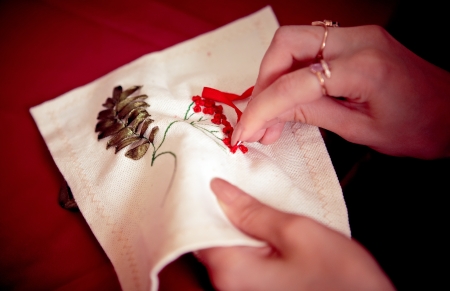 Embroidery ribbons. Handwork. CU of woman hand with a needleの写真素材