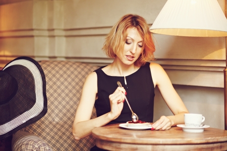 Tasting cherry pie with a spoonの写真素材