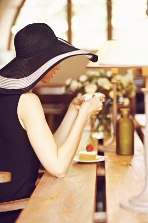 Girl in a wide-brimmed hat backの写真素材