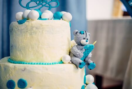 wedding cake and turquoise wine behind purple wallpaperの写真素材