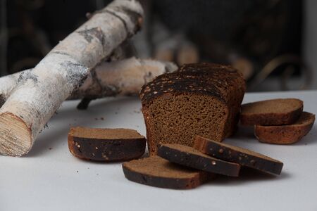 Fresh brown bread slice isolated on white background