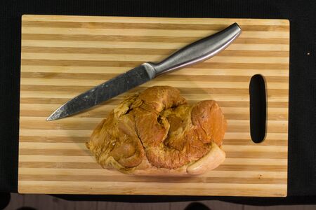 Sliced ham on wooden cutting board. Fresh prosciutto. On a wooden board