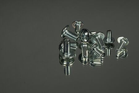 Wood screws set on a blue background. Postcard concept for men. Mirror reflection