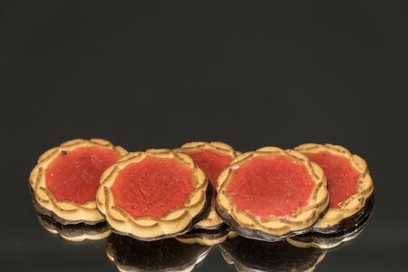 Cookies with jam on a mirror black background. Top views.の写真素材