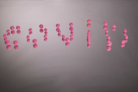 The inscription on the mirror consisting of carp boilies, COVID on dark mirror backgroundの写真素材