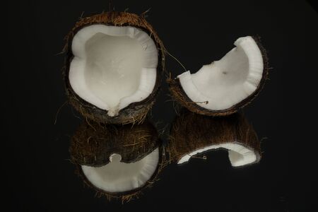 Coconut on a black background. Dark mirror backgroundの写真素材