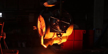 Metal smelting in a metallurgical plant at night.