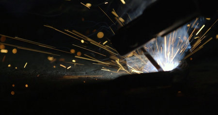 Welding robots movement in a car factory. Industrial welding robots movement in a car factory