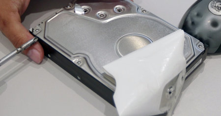 Close up of hard disk drive on white background with clipping path.
