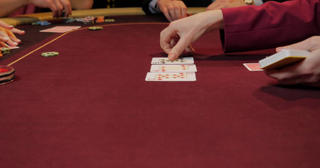 Poker table with chips and cards in casino, close-up