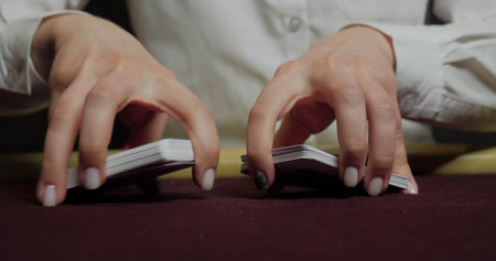 Close up of hands of a woman reading a book in the roomの写真素材