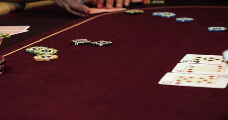 Poker table with chips and cards, close-up. Focus on chipsの写真素材