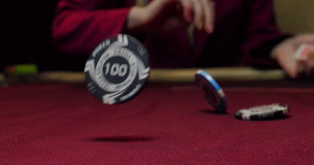 blur image of a man playing poker in a casino, shallow depth of field