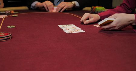 Cards and chips on a red table in a casino, poker